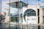 The Marie-Elisabeth-Lüders-Haus is reflected in the facade of the Paul-Löbe-Haus across the river Spree in Berlin, Germany 125-1F0A83241020x1530_vividvista