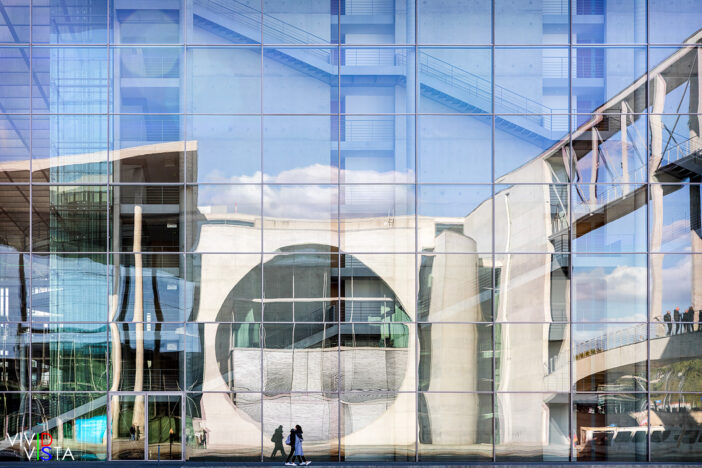 The Marie-Elisabeth-Lüders-Haus is reflected in the facade of the Paul-Löbe-Haus across the river Spree in Berlin, Germany 1F0A8319_vividvista